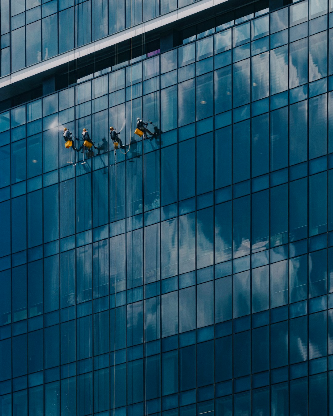 Crafting Captivating Headlines: Your awesome post title goes here Window washers cleaning the glass windows of TRX tower in Malaysia